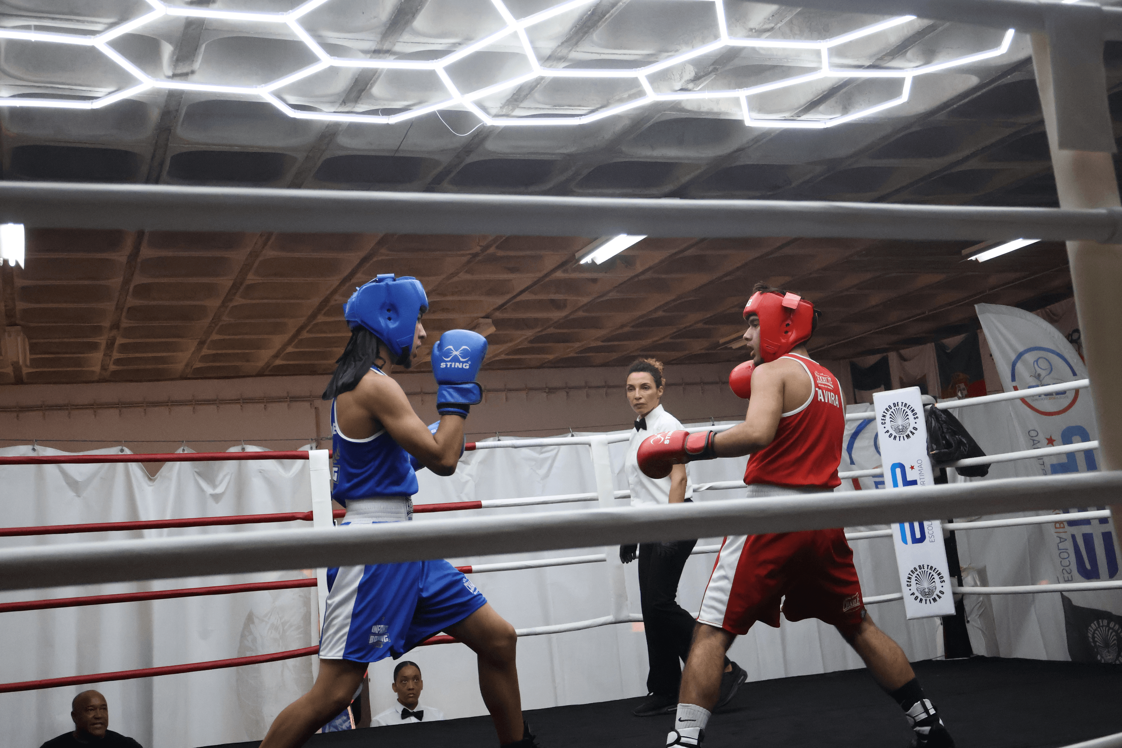 Two boxers in the middle of a competitive match.